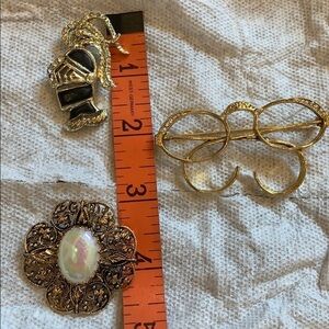 3 gold tone costume jewelry brooches